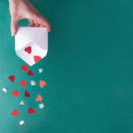 paper hearts falling from an envelope